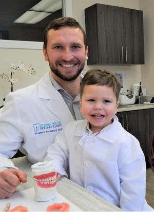 Dr. Yevgeniy Sorokatyy and his son Jordan at the clinic
