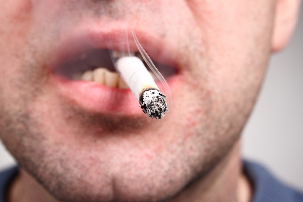 man smoking increases oral cancer risk