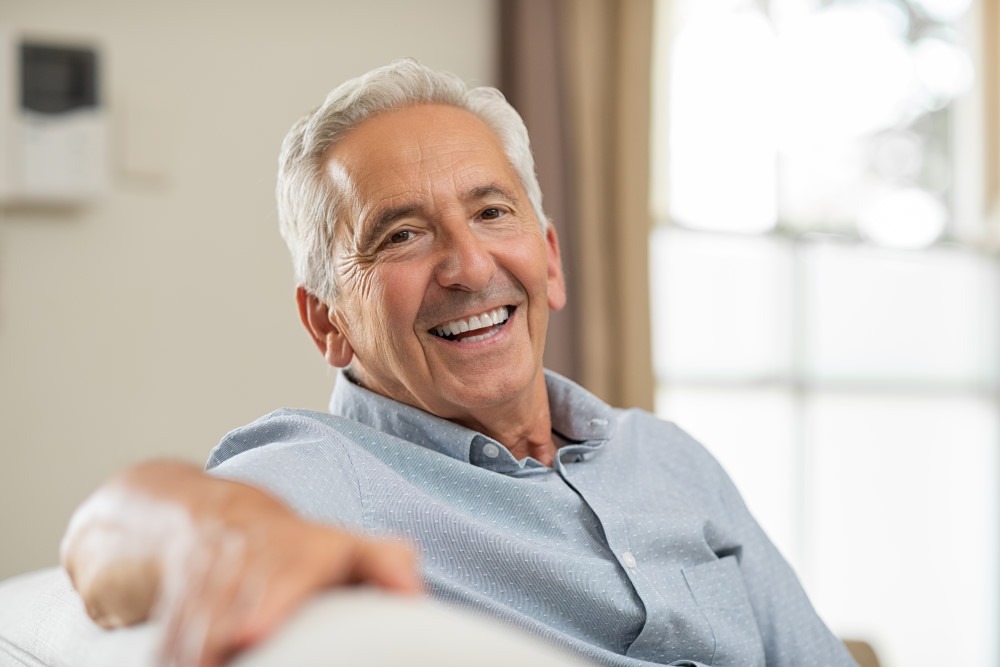 man smiling with partial dentures