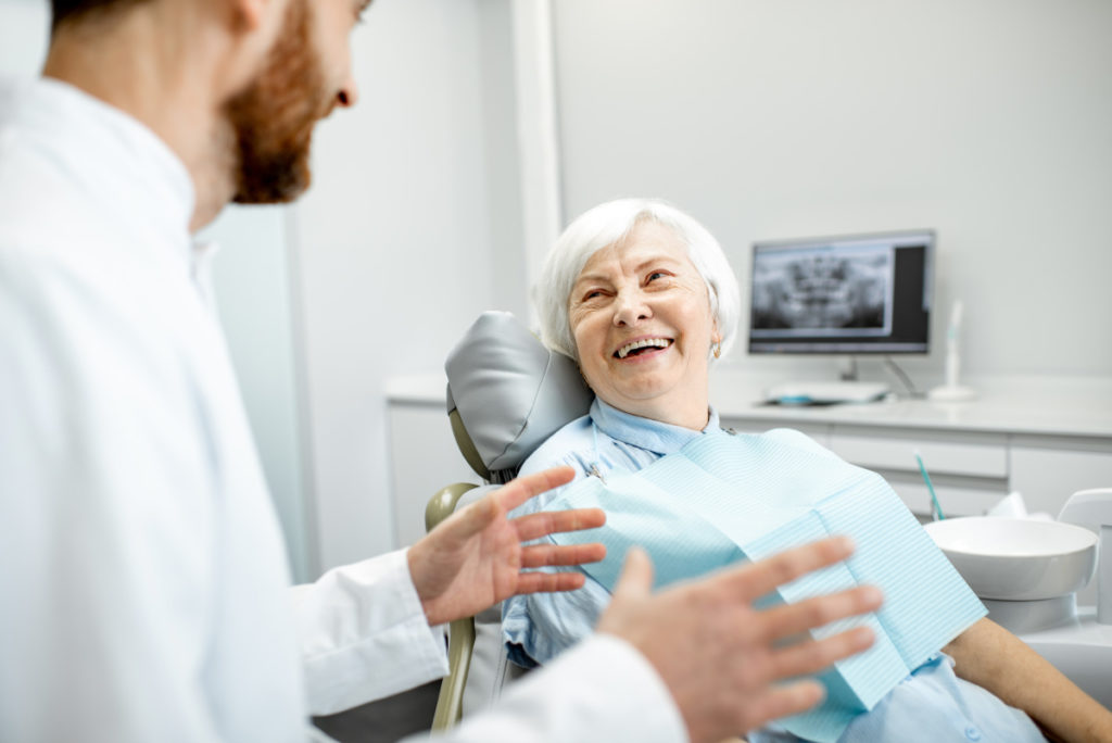 The Difference Between Dental Implants & Implant Dentures