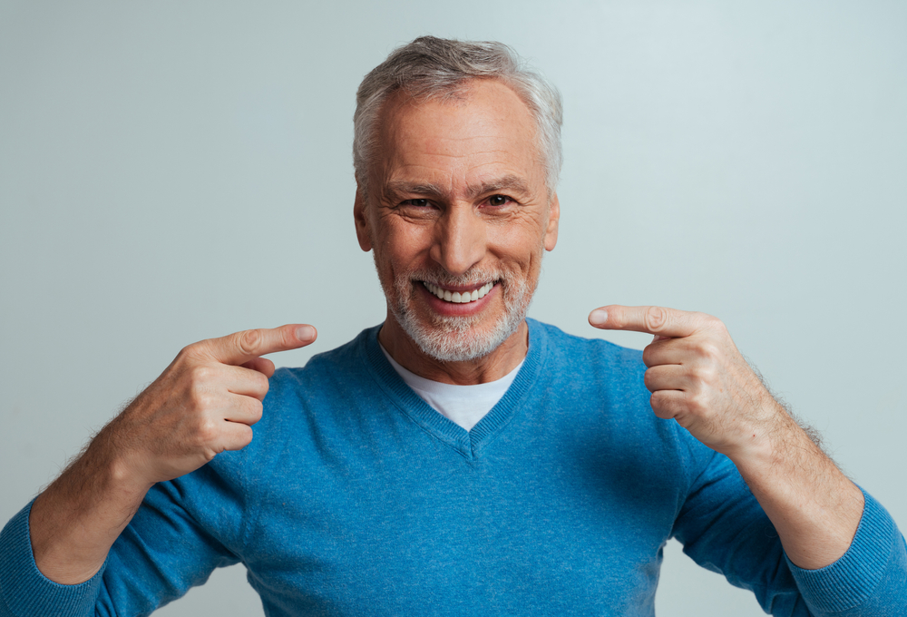 man with dentures smiling and happy
