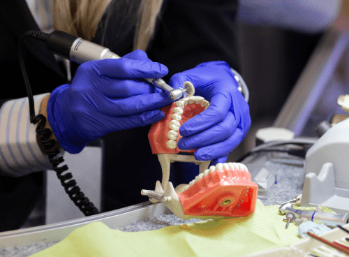 Denturist performing denture repair