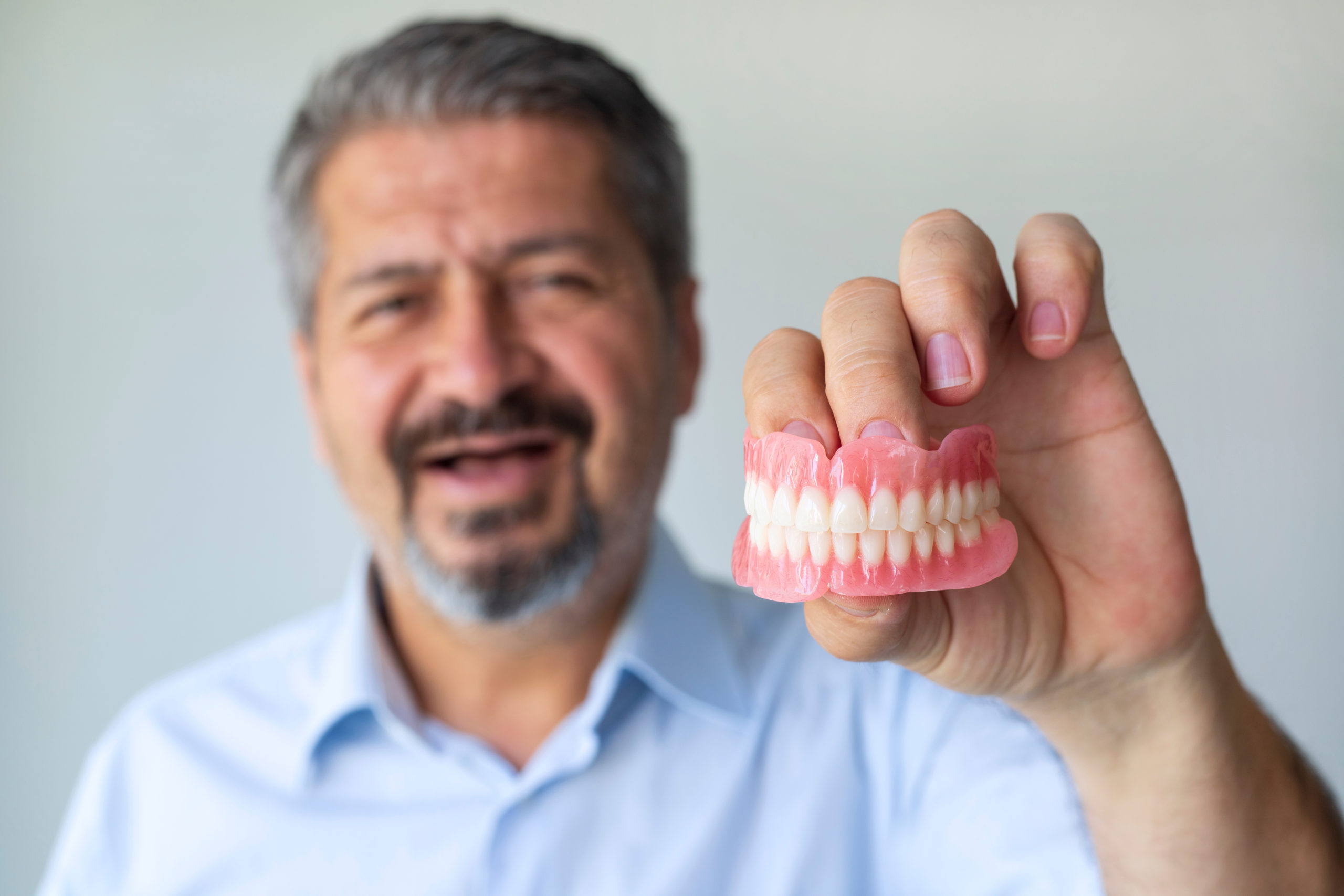 man displaying his dentures